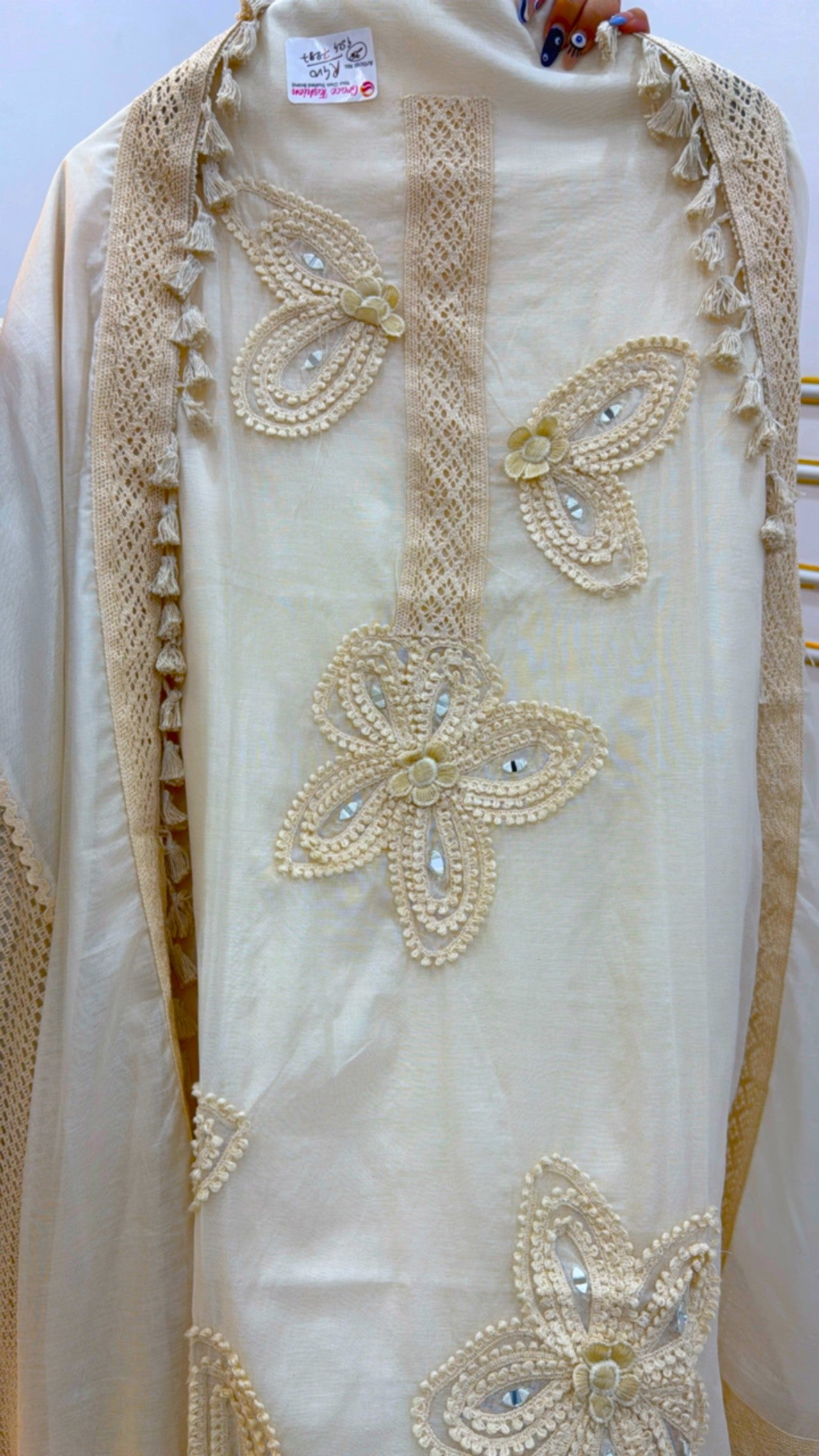 Elegant cotton suit set with detailed flower embroidery and intricate lace trim for stylish occasions